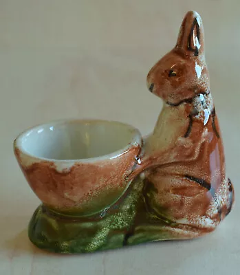 Buy Rabbit Egg Cup - Brown Mottled Bunny Standing Upright By Egg Cup On Green Grass  • 5£