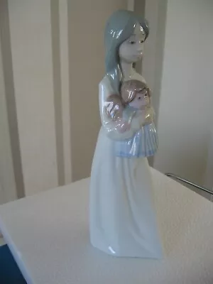 Buy  Nao  By Lladro Girl With Doll 1990. • 8£