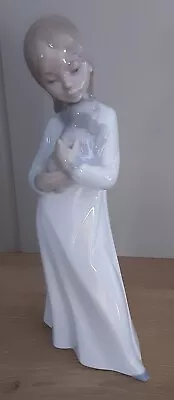 Buy Lladro Nao Figurines  GIRL IN NIGHTWEAR  HOLDING A PUPPY  • 1£
