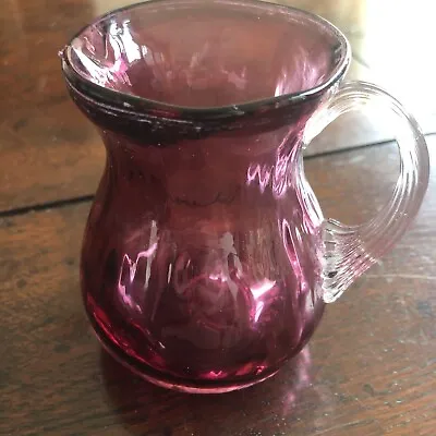 Buy Cranberry Glass Jug With Chip On Spout 9cm Tall  • 4.99£