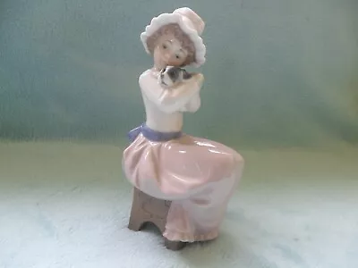 Buy Nao Lladro Girl Sitting Down Holding A Dog Figurine • 10£