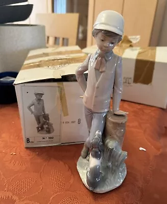 Buy Lladro Nao Figurines - Boy With Dog Leaning On Tree Stump With Box. • 25£