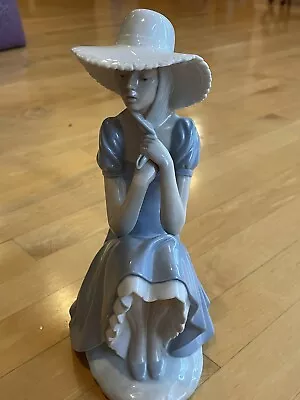 Buy NAO By LLADRO - PENSIVE GIRL IN LARGE SUNHAT SITTING ON A ROCK WALL Mint • 75.78£