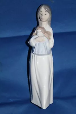 Buy Nao By Lladro Girl Holding A Doll • 15£