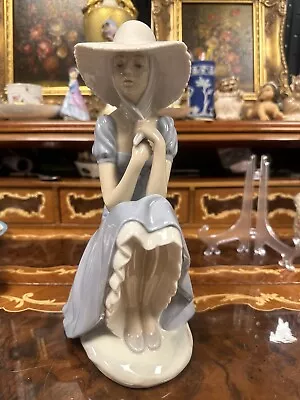 Buy 11  Nao / Lladro - Pensive Girl In Large Sunhat Sitting On A Rock Wall. • 28£