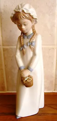 Buy Nao By Lladro Girl Holding Basket Of Sweets Figurine Model Number 0597 • 19.99£