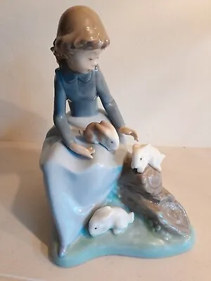Buy Nao By Lladro. Young Girl Sitting On A Log Playing With 3 Rabbits. Retired.  • 29.99£