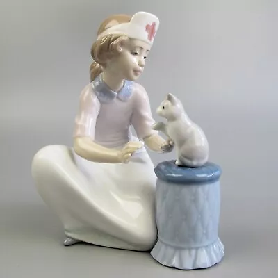 Buy Lladro Figurine  Loving Care  #6087. Girl Playing Vet, Nurse Or Doctor With Cat. • 159.99£
