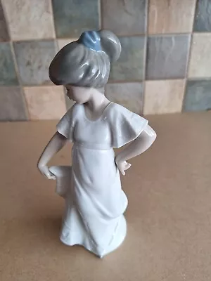Buy Nao By Lladro Of A Girl Wearing Her Hair In A Bun & Holding Her Dress Up • 4.50£