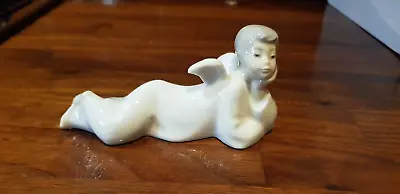 Buy NAO Lladro Figurine Of A Boy Angel ? Lying Down With Head On Hand • 14.75£